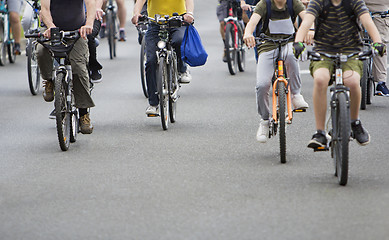 Image showing Bicyclists in traffic on the streets of the city