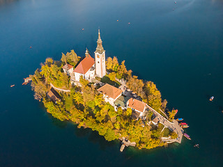 Image showing Aerial view of Bled island on lake Bled, and Bled castle and mountains in background, Slovenia.