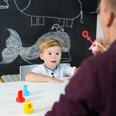 Image showing Cute little toddler boy at child therapy session.