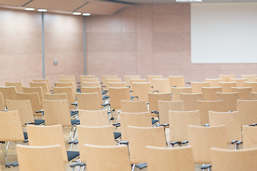 Image showing Empty wooden seats in a cotmporary lecture hall.