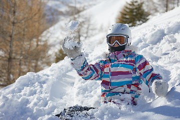 Image showing Snowboarder having a rest