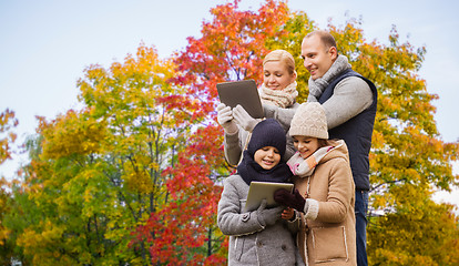 Image showing family with tablet pc computers over autumn park