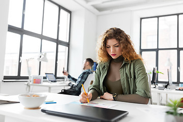 Image showing creative woman working on user interface at office