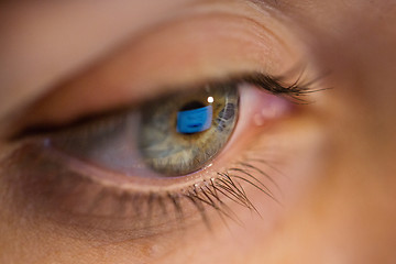 Image showing close up of woman eye looking at computer screen