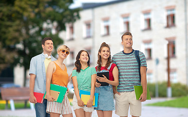 Image showing students with books and folders over school