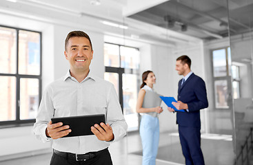 Image showing realtor with tablet pc and customers at office