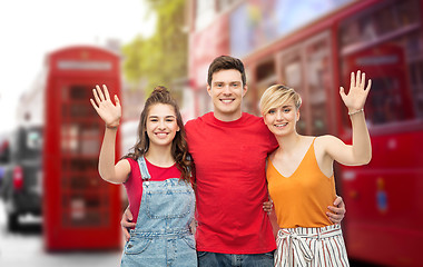 Image showing happy friends over london city street background