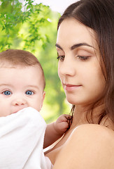 Image showing mother with baby over green natural background