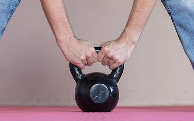 Image showing Black kettlebell ina gym