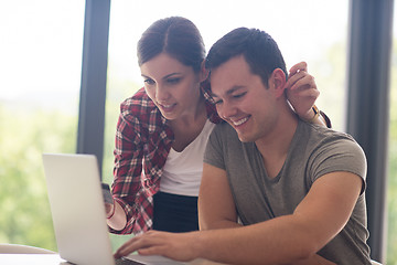 Image showing happy young couple buying online