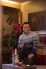 Image showing Happy young man with a glass of champagne