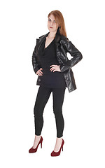 Image showing Woman standing in leather jacket