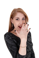 Image showing Surprised young woman, hand on face