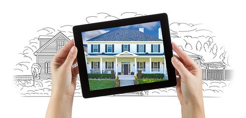 Image showing Female Hands Holding Computer Tablet with House Photo on Screen 