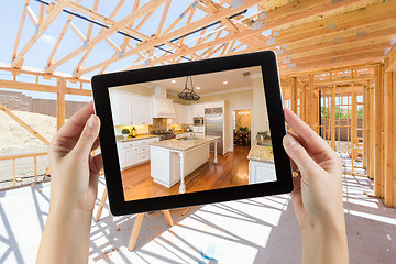Image showing Female Hands Holding Computer Tablet with Finished Kitchen on Sc