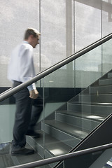 Image showing Businessman ascending stairs