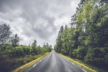 Image showing Asphalt road with white stripes