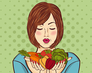 Image showing beautiful red-haired lady with vegetables in his hands