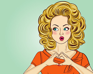 Image showing Blonde pop art woman making heart sign with hands. Comic woman .