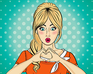 Image showing Blonde pop art woman making heart sign with hands. Comic woman .