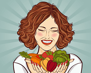 Image showing beautiful red-haired lady with vegetables in his hands