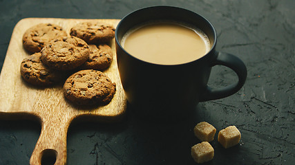 Image showing Cup of coffee with cookies