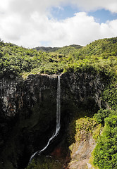 Image showing Aerial top view perspective of amazing 500 feet tall waterfall in the tropical island jungle of Mauritius.