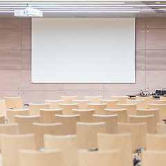 Image showing Empty wooden seats in a cotmporary lecture hall.