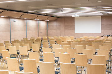 Image showing Empty wooden seats in a cotmporary lecture hall.