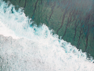 Image showing Aerial shot of the braking wave in the ocean.