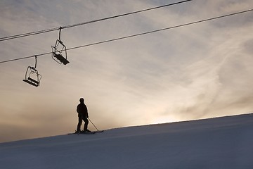 Image showing Skier silhouette against glowing sky