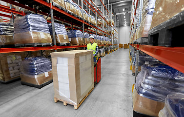 Image showing loader operating forklift at warehouse