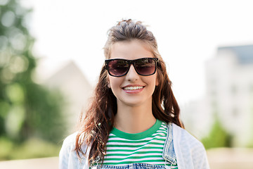 Image showing portrait of young woman in sunglasses outdoors