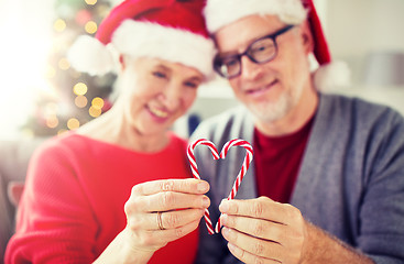 Image showing senior couple with heart of christmas candy canes