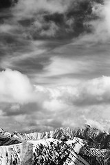 Image showing Black and white winter snow mountains and cloudy sky