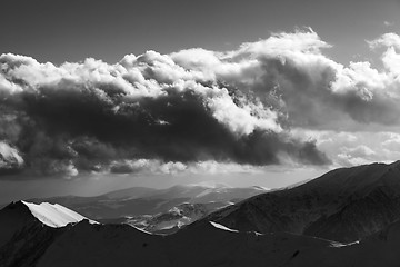 Image showing Black and white view on winter mountains in evening and sunlight