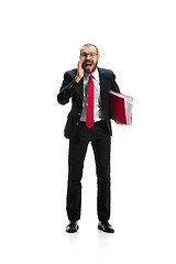 Image showing Do not miss. Young casual man shouting. Shout. Crying emotional man screaming on white studio background