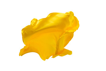 Image showing Smooth elegant transparent yellow cloth separated on white background.