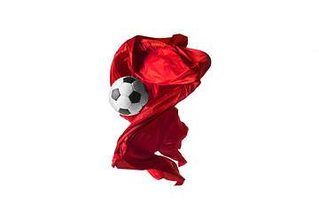 Image showing Soccer ball and Smooth elegant transparent red cloth isolated or separated on white studio background.