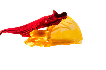 Image showing Smooth elegant transparent yellow, red, cloth separated on white background.