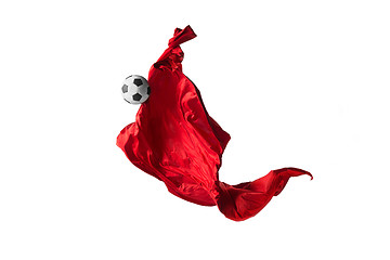 Image showing Soccer ball and Smooth elegant transparent red cloth isolated or separated on white studio background.