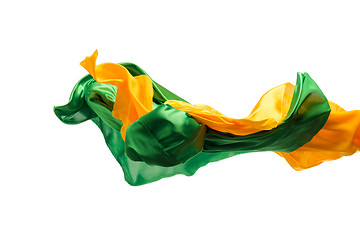 Image showing Smooth elegant transparent yellow, green cloth separated on white background.