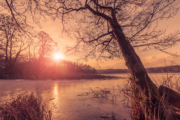 Image showing Sunset over a frozen lake in the winter
