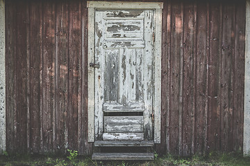 Image showing Old wooden door with weathered paint