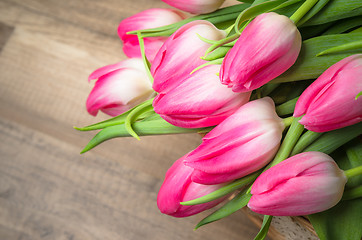 Image showing Beautiful bouquet from pink tulips  on a table