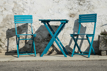 Image showing pictoresque blue chairs on a street