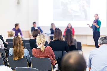 Image showing Woman giving presentation on business conference workshop.