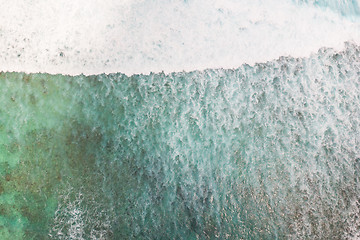 Image showing Aerial shot of the braking wave in the ocean.