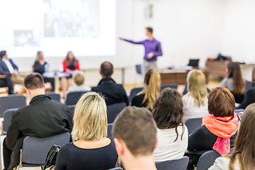 Image showing Business speaker giving a talk at business conference event.