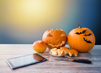 Image showing halloween jack-o-lantern, pumpkins and tablet pc